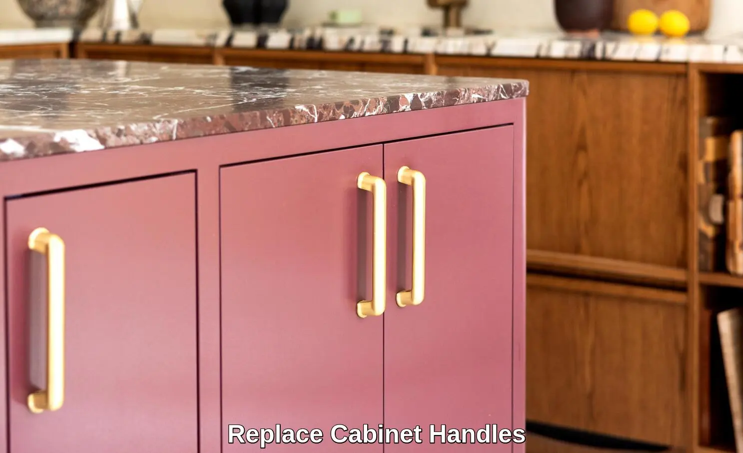DIY kitchen cabinet painting with bold navy blue and brass handles